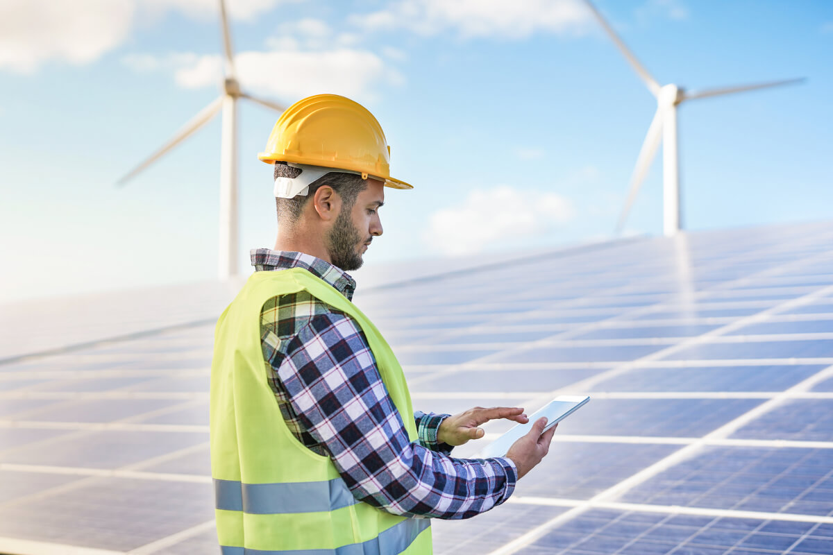 man-working-at-solar-power-station-with-digital-ta-2021-09-03-13-35-47-utc.jpg